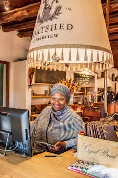 restaurant manager greeting customers with smile